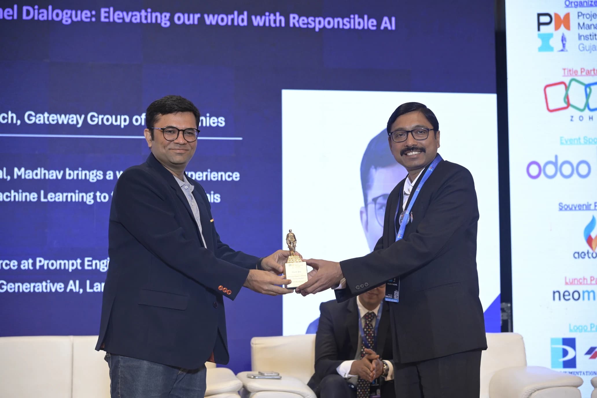 Madhav Anadkat — PMI Gujarat Chapter panel, post-session portrait with token of appreciation