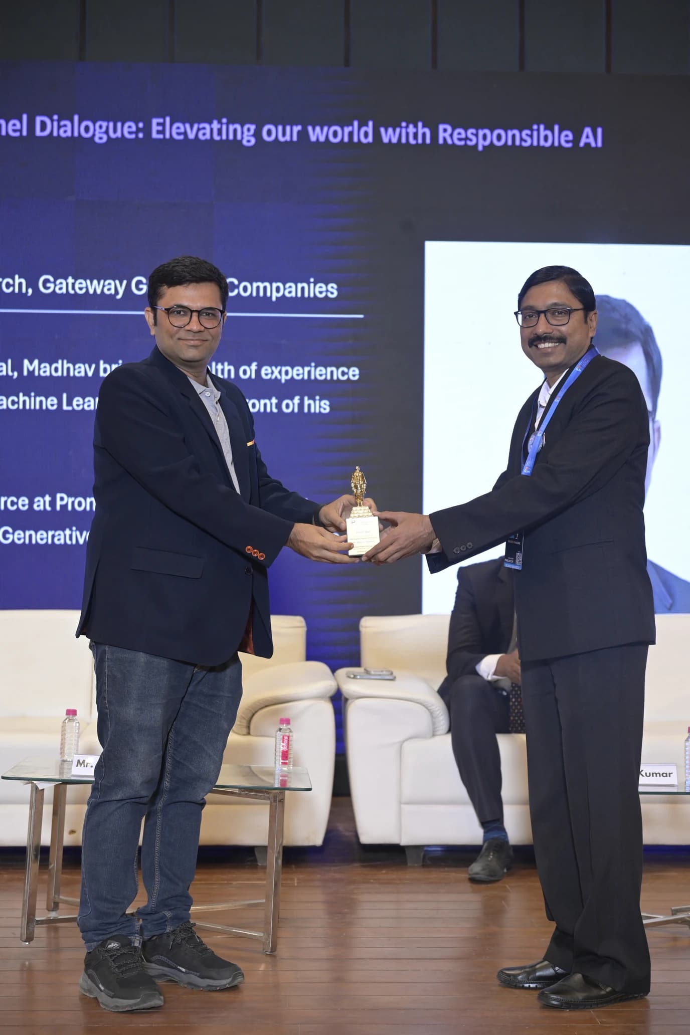 PMI Gujarat Chapter — panel discussion, mic close-up