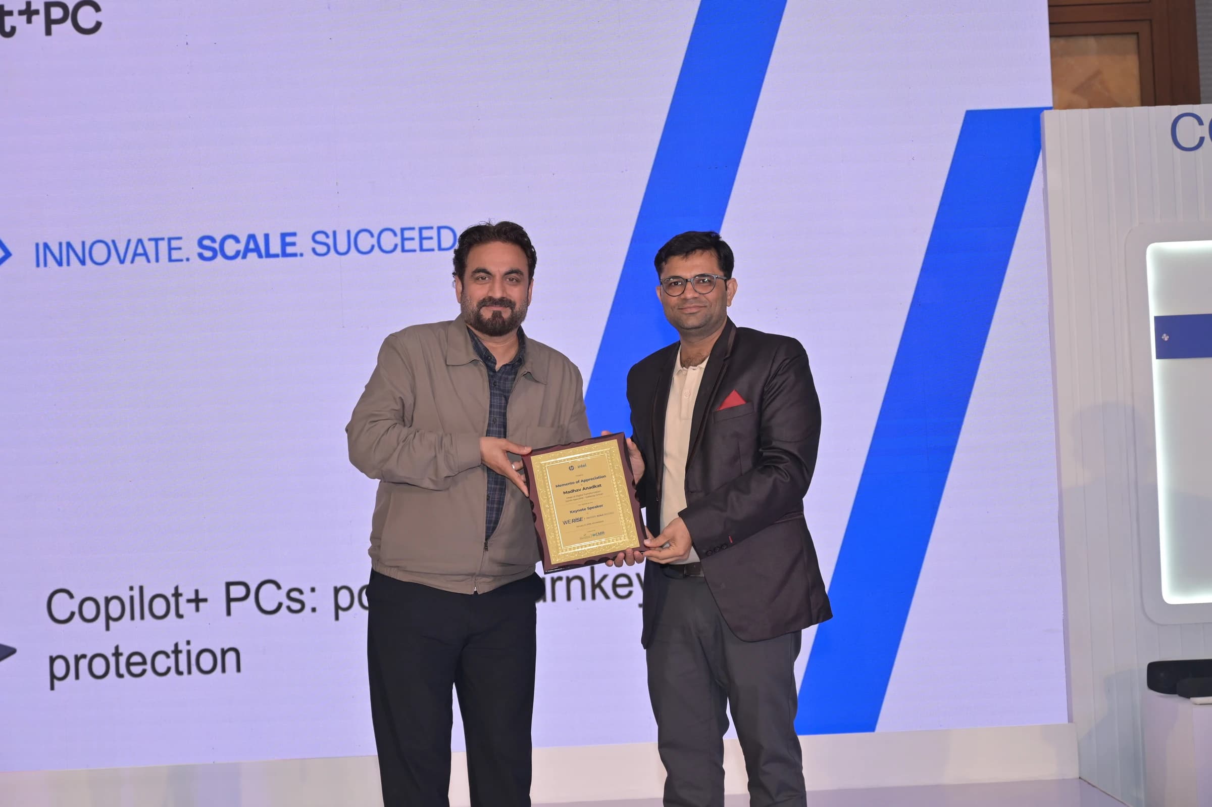 Madhav Anadkat receiving recognition at HP WeRise — Ahmedabad